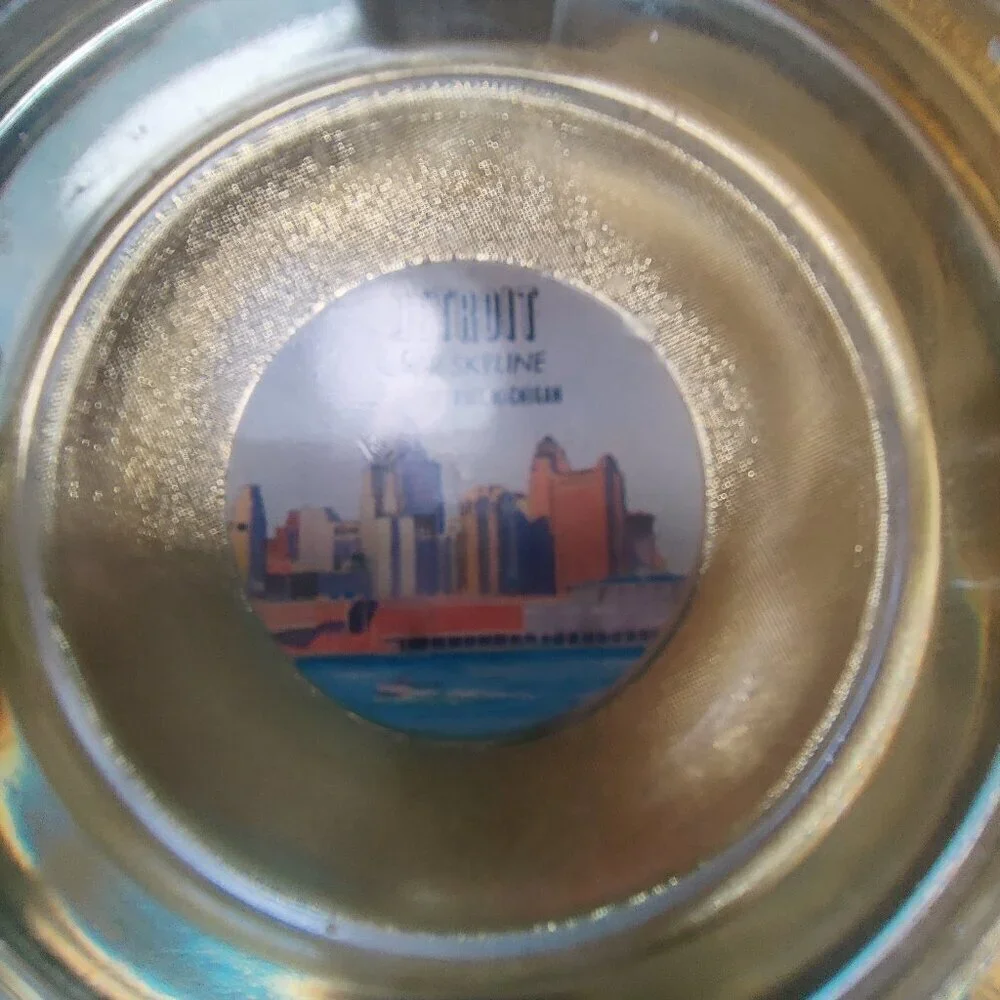 Ships wheel Ashtray with Detroit Skyline from 1960''s. For decorative purposes.
